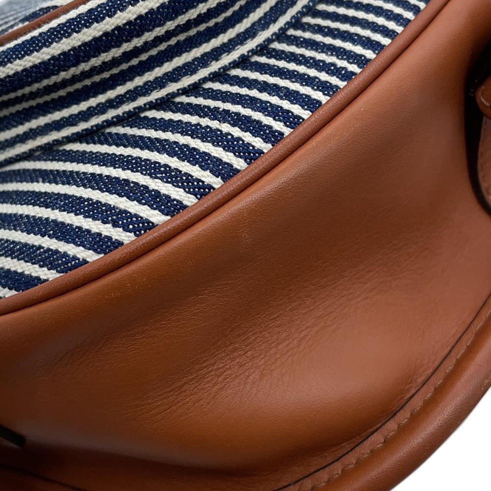 Interior of a Celine Pre-Owned bag featuring a striped fabric lining for stylish organization