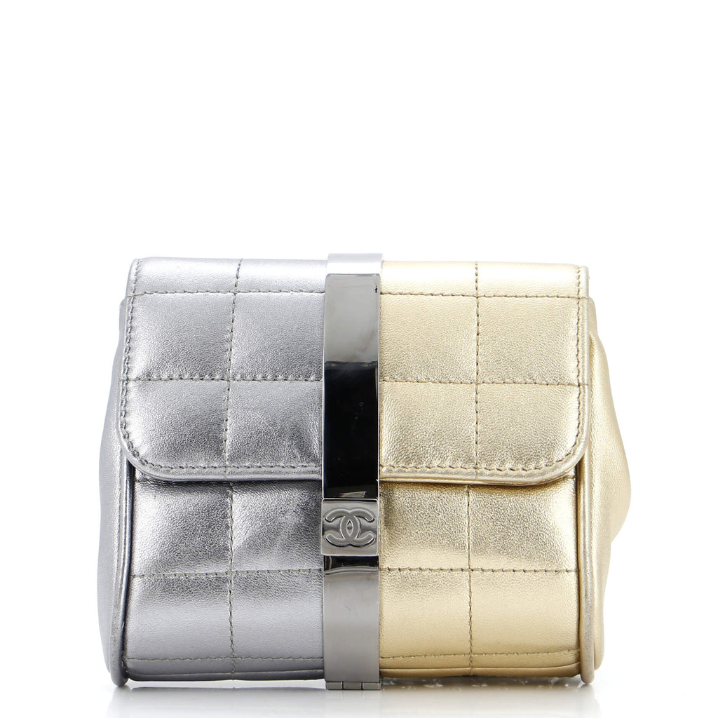 Stylish pre-owned CHANEL wristlet bag in silver and gold metallic finish with quilted design