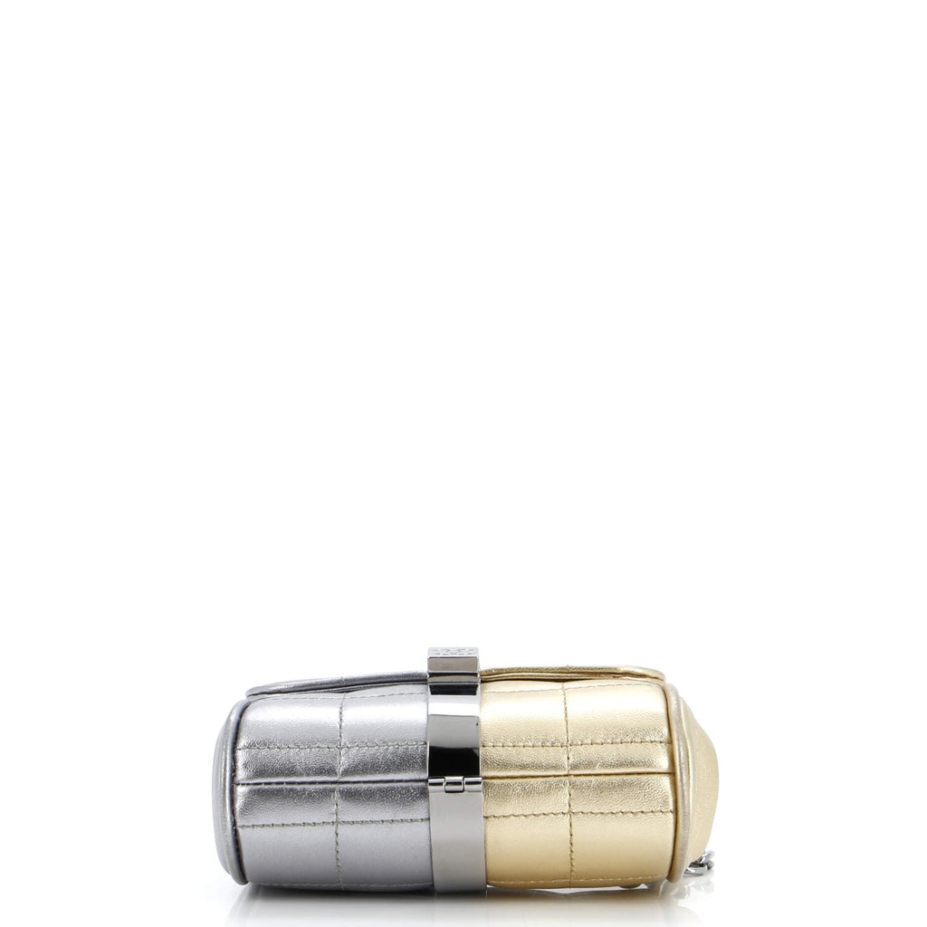 Stylish pre-owned CHANEL wristlet bag in silver and gold with a sleek design