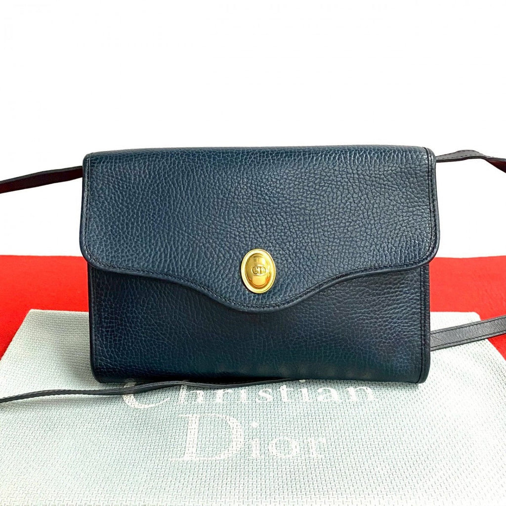 Dior pre-owned leather bag in black with a gold clasp and adjustable strap