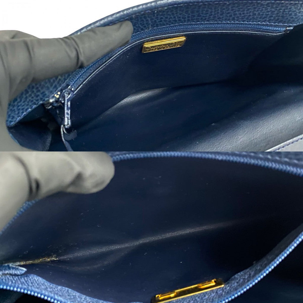 Inside view of a pre-owned Dior bag showcasing the spacious zip pocket and luxurious lining