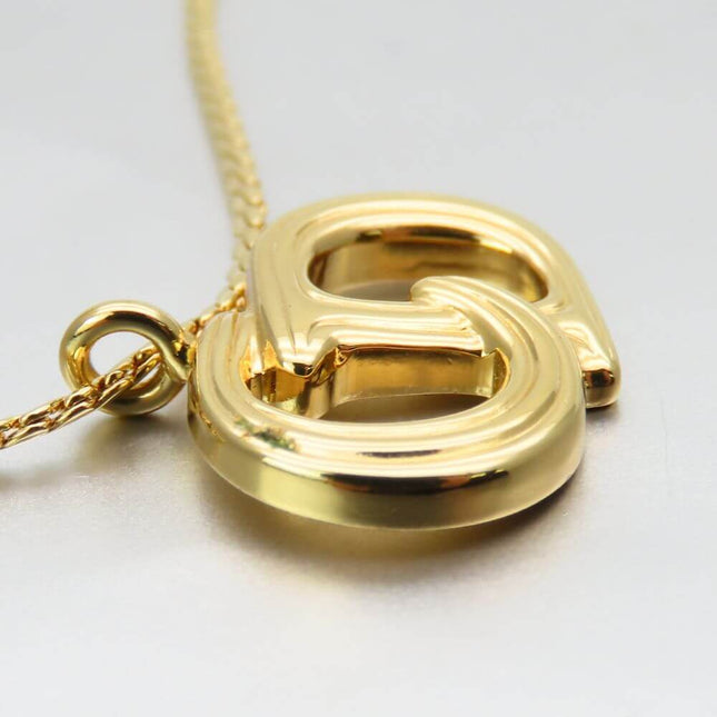 Christian Dior pre-owned gold pendant necklace with a unique logo design