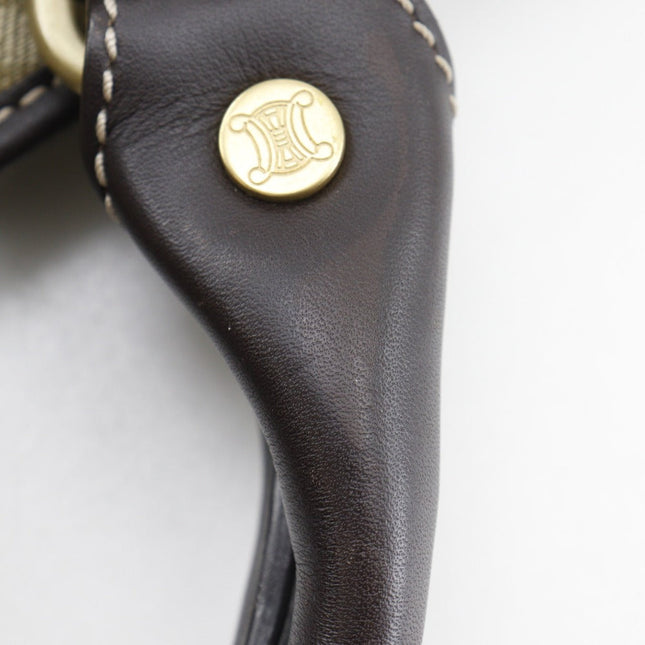 Close-up of a pre-owned CELINE bag strap with gold hardware and stitching detail
