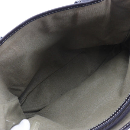 Inside view of a CELINE pre-owned bag featuring a spacious interior with green lining