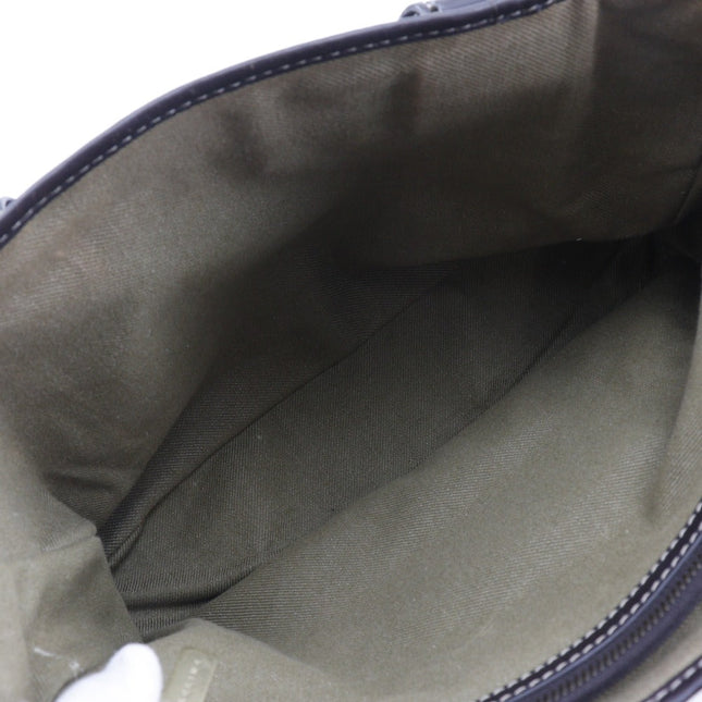 Inside view of a CELINE pre-owned bag featuring a spacious interior with green lining