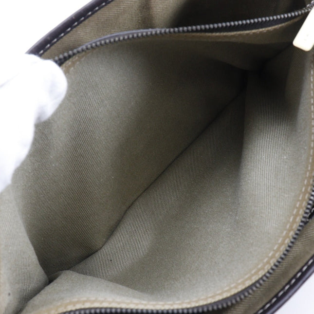 Interior view of a pre-owned CELINE bag with spacious olive green lining and zip closure