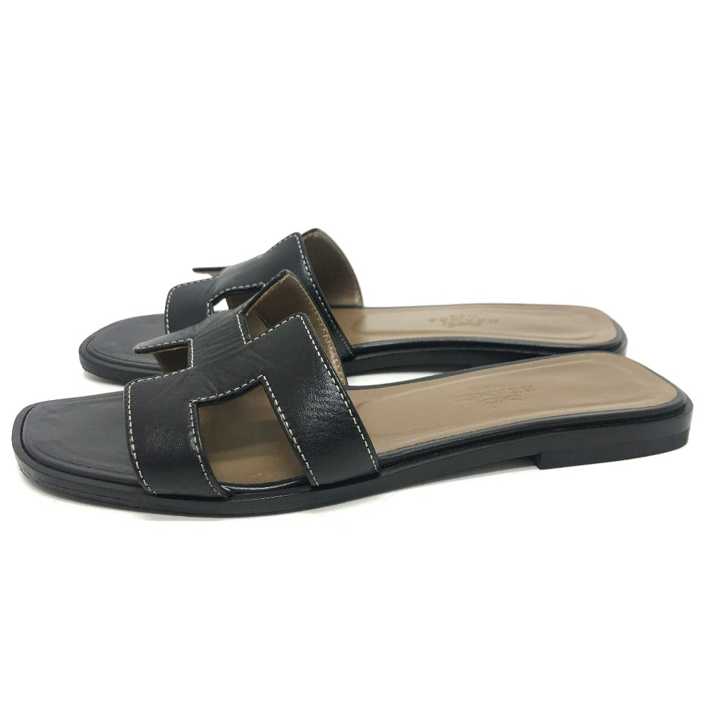 Pre-owned Hermes Oran sandals in black leather with stylish cutout design for casual wear