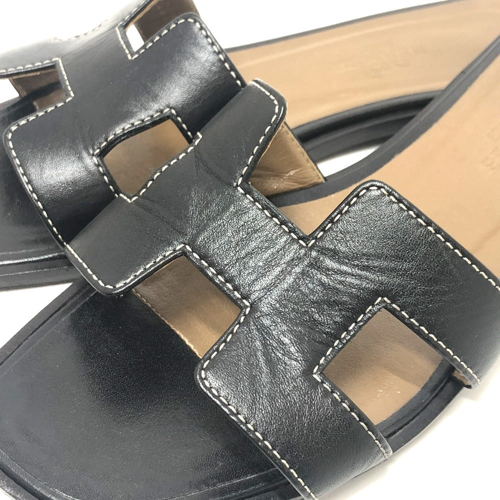 Pre-owned Hermes Oran sandals in black leather with signature H cutout design