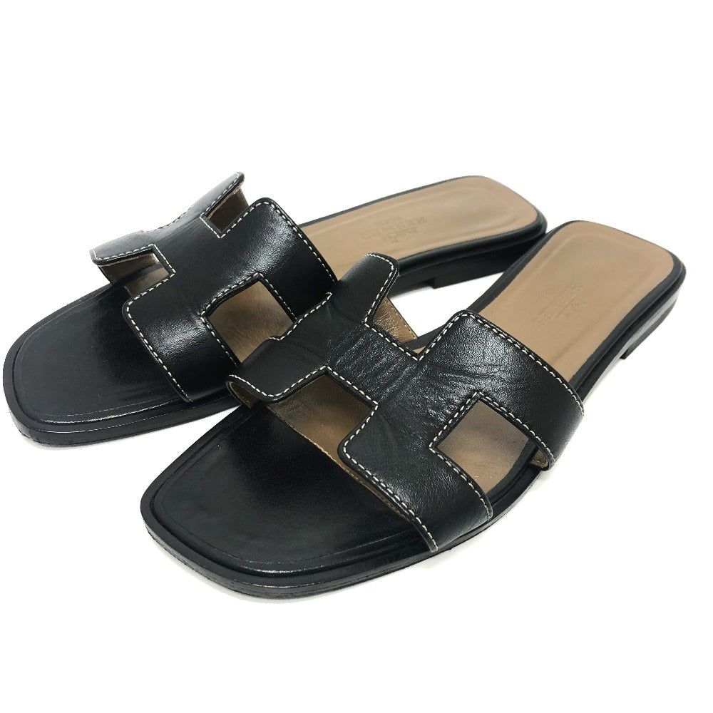 Pre-owned Hermes Oran sandals in black leather with a stylish open design for casual wear
