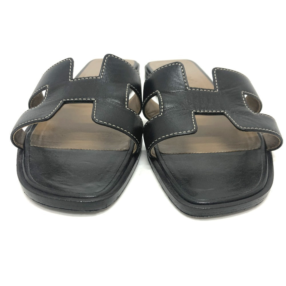Pre-owned Hermes Oran sandals in black leather featuring classic H cut design for casual elegance