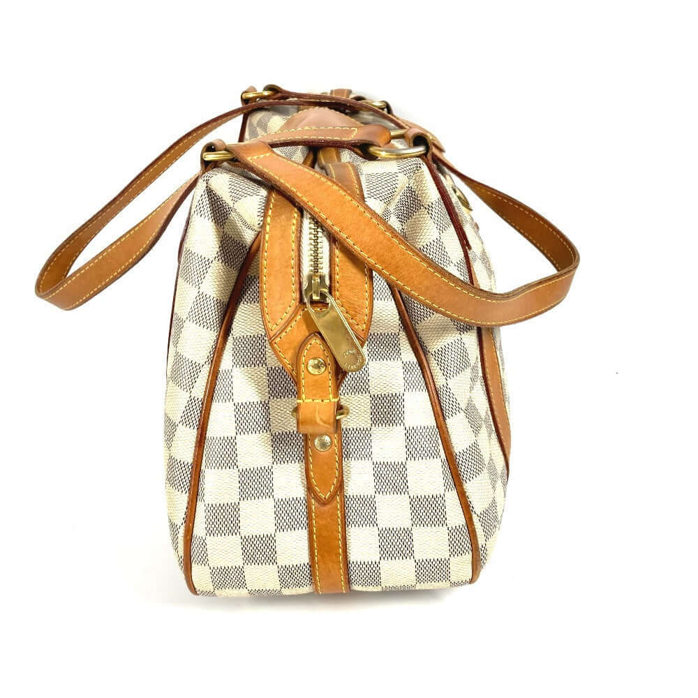 Louis Vuitton pre-owned checkered bag with leather accents and adjustable straps