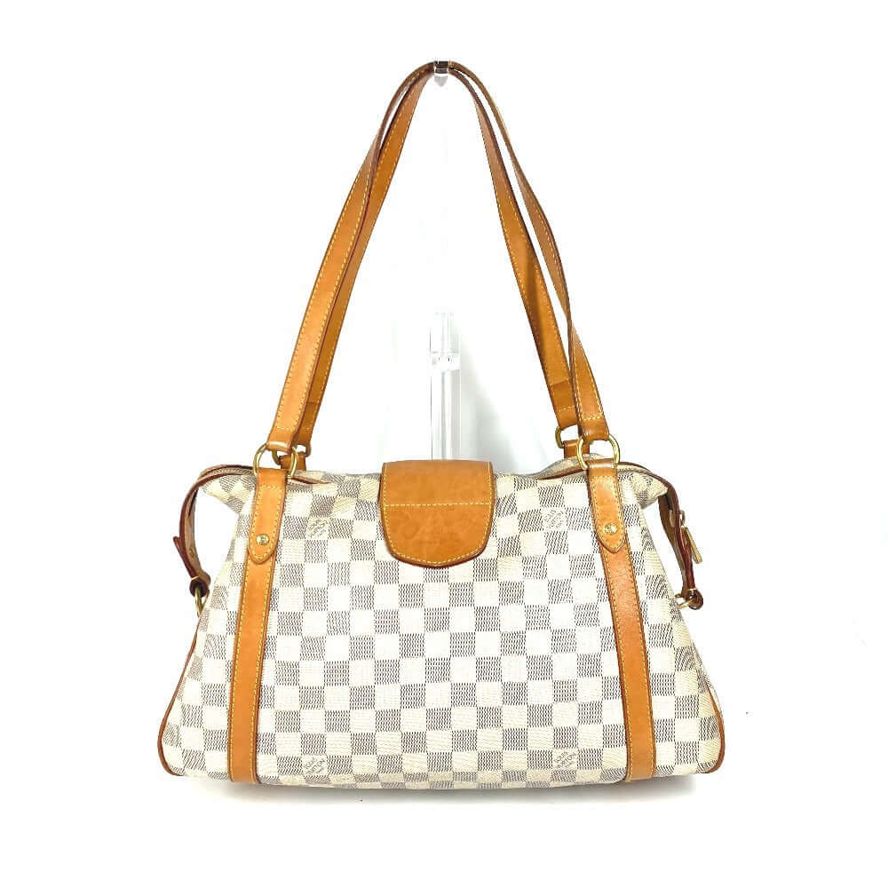 LOUIS VUITTON pre-owned handbag with a checkered pattern and leather straps for stylish everyday use