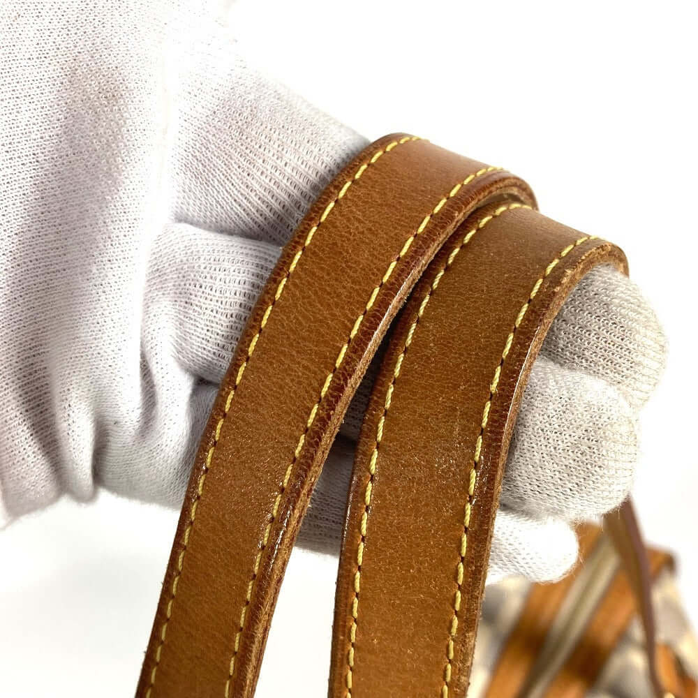 Close-up of the leather strap on a pre-owned Louis Vuitton bag showcasing quality craftsmanship