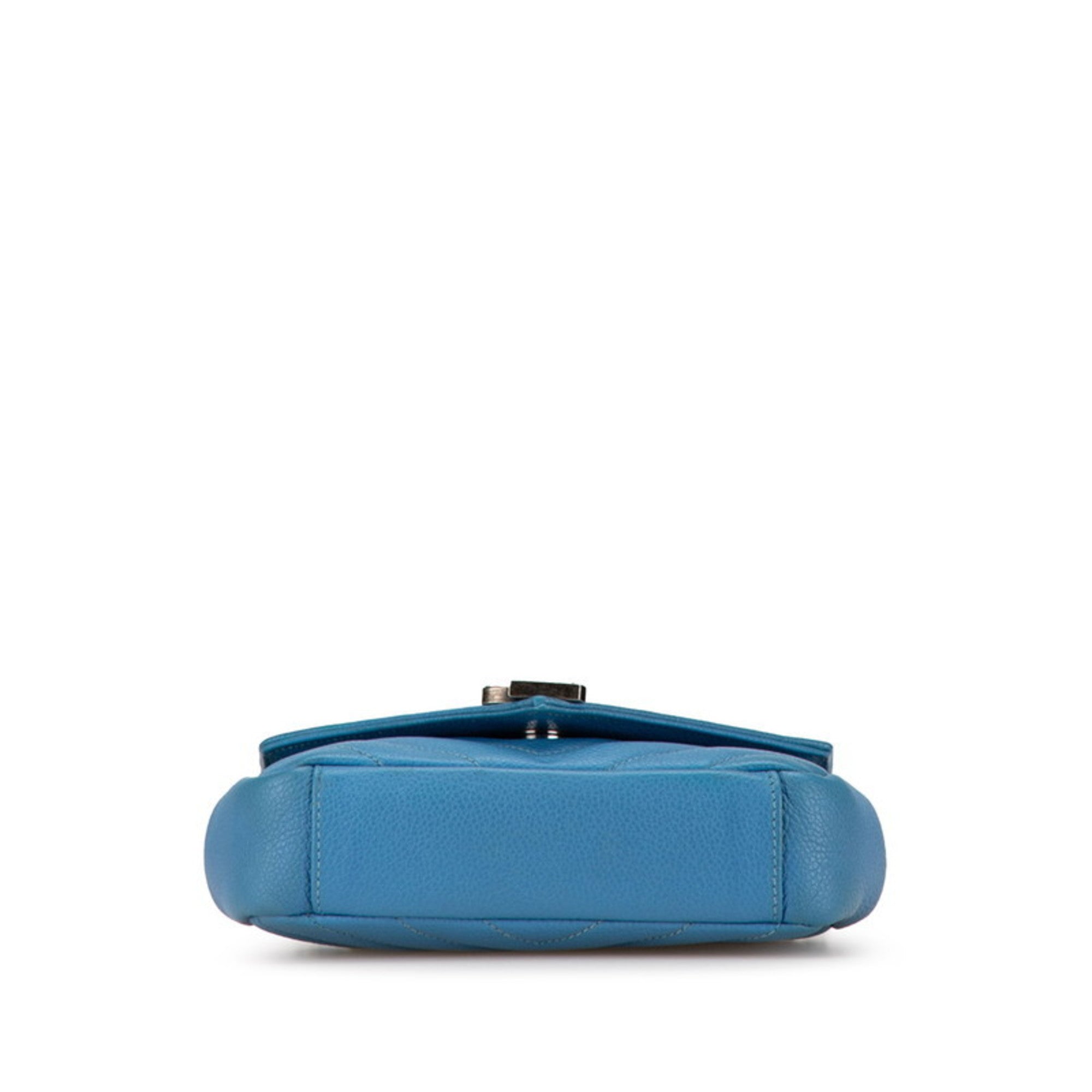 View of the base of a pre-owned Saint Laurent Baby Chai bag in blue leather with elegant design