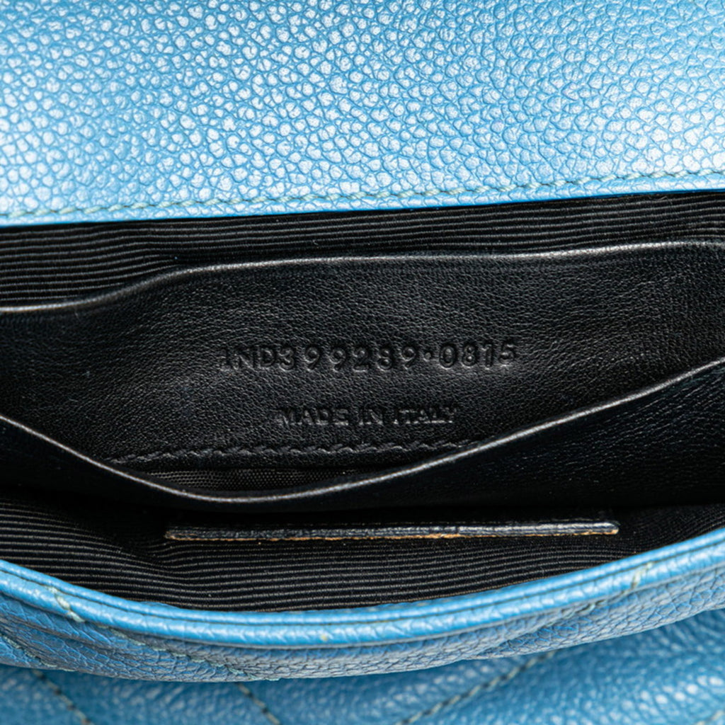 Interior view of pre-owned Saint Laurent Baby Chai bag featuring black leather lining and made in Italy tag