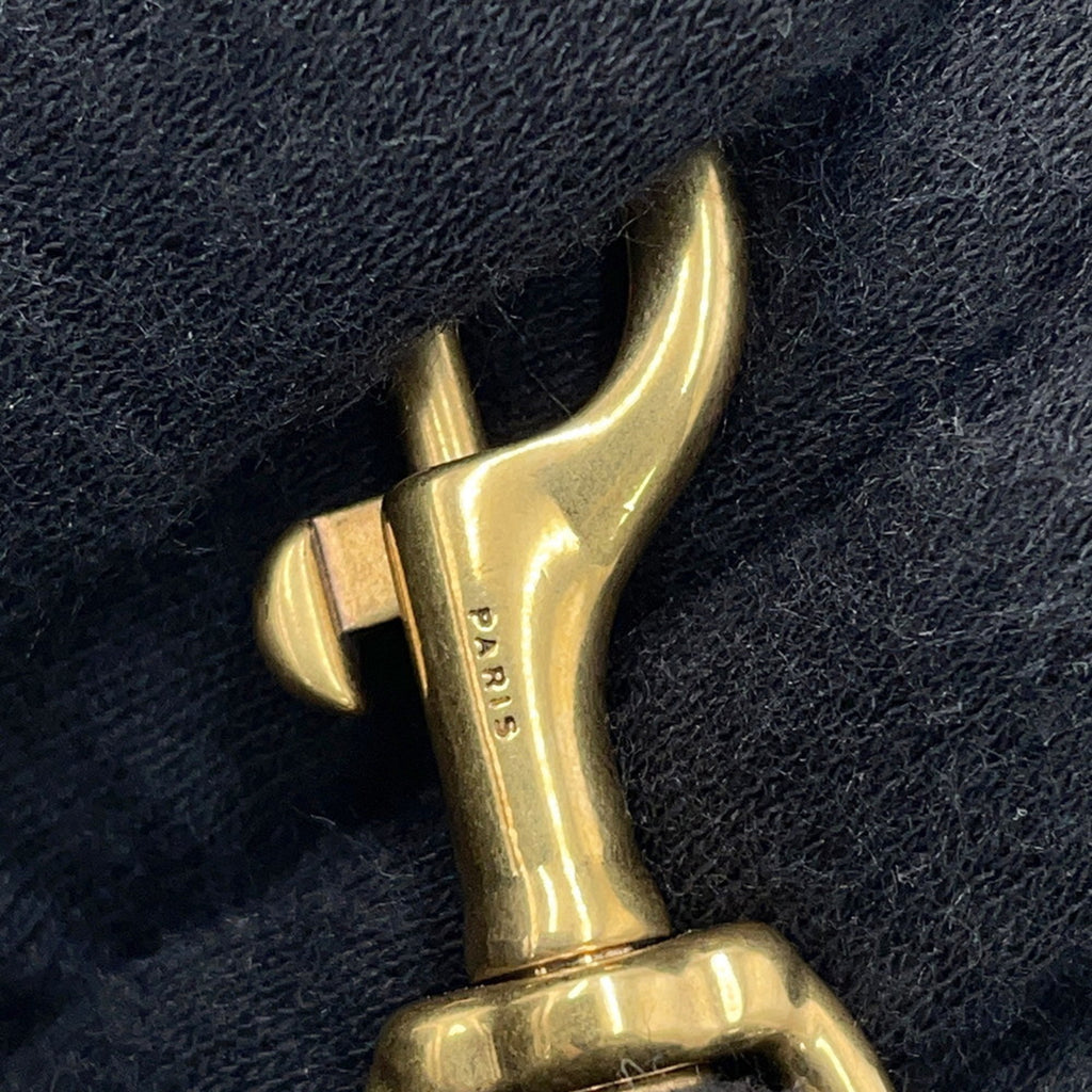 Close-up of the clasp detail on the SAINT LAURENT Seria Mini 2 way bag showcasing premium craftsmanship