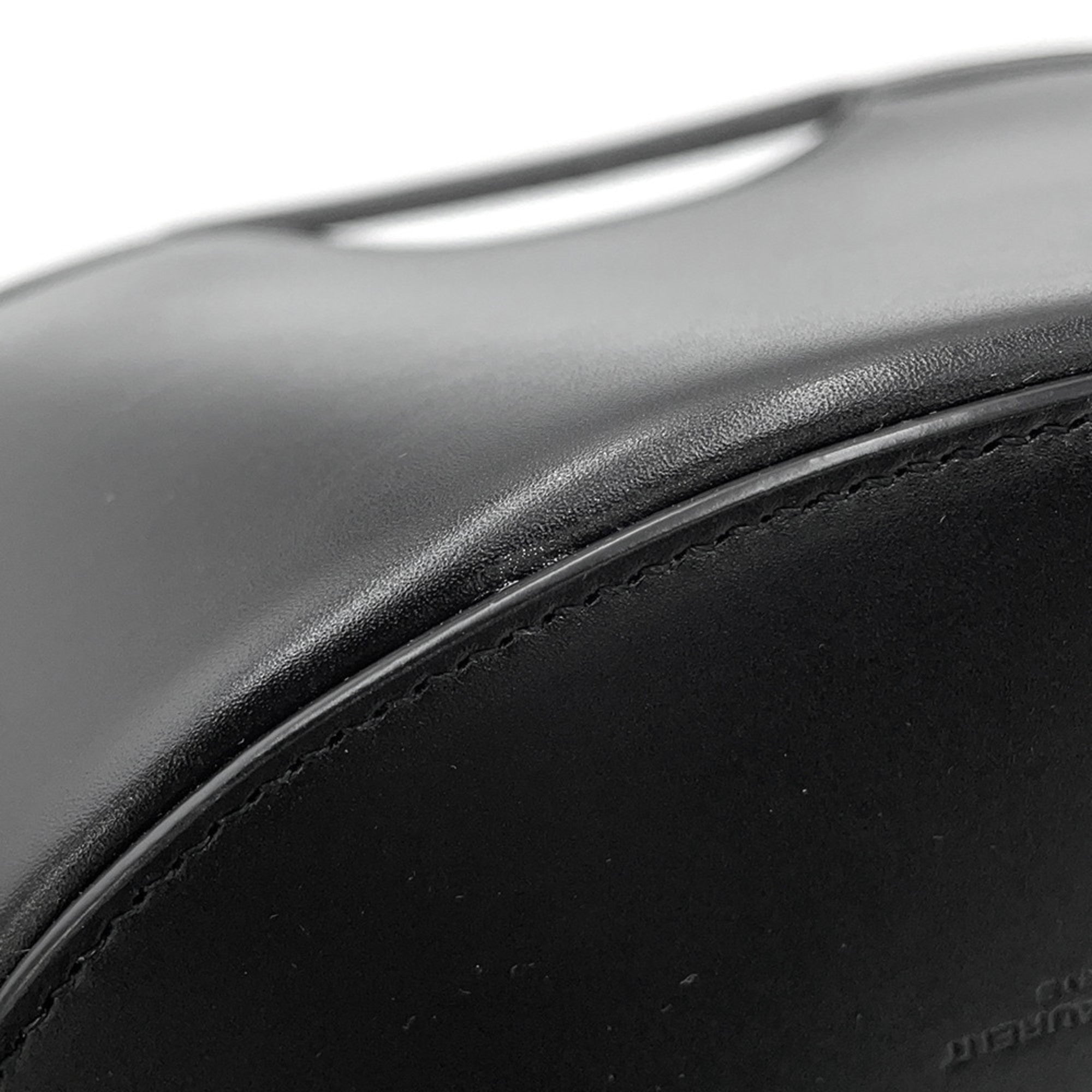 Close-up of MANSII SAINT LAURENT Seria Mini 2 way bag in black, highlighting premium leather texture