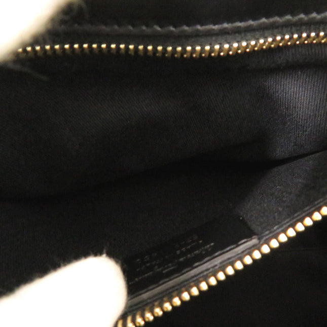 Interior view of a Salvatore Ferragamo pre-owned bag showing black fabric lining and gold zipper details