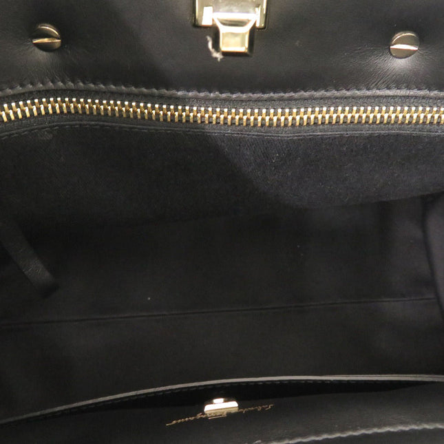 Interior view of a pre-owned Salvatore Ferragamo bag with gold zipper and soft lining
