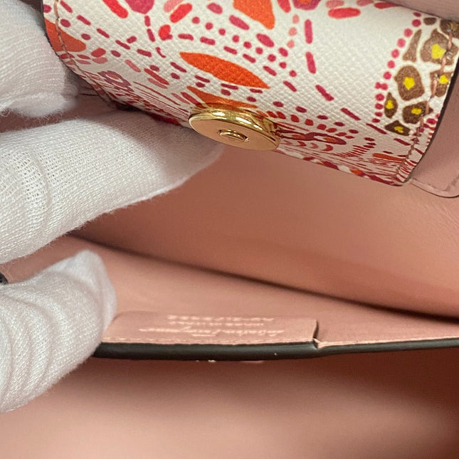 Salvatore Ferragamo pre-owned bag with colorful floral print and secure button closure