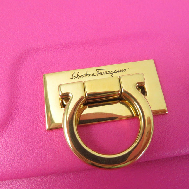 Close-up of Salvatore Ferragamo pre-owned pink bag with gold hardware and logo detail
