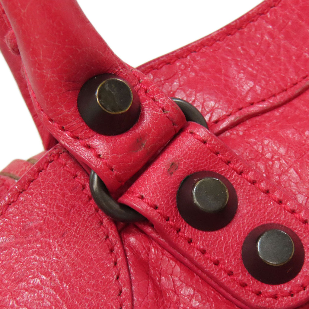 Close-up of a BALENCIAGA pink leather bag highlighting the hardware, offered as second hand