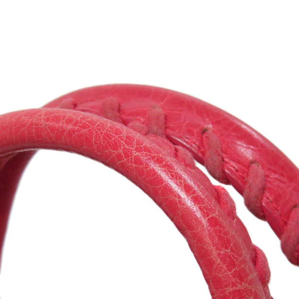 Second hand Balenciaga pink braided leather bag strap close-up showing texture and detailing