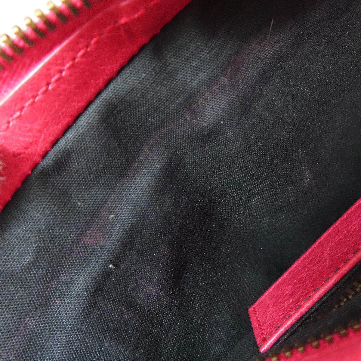 Inside view of a BALENCIAGA bag showing dark fabric lining, available as second hand