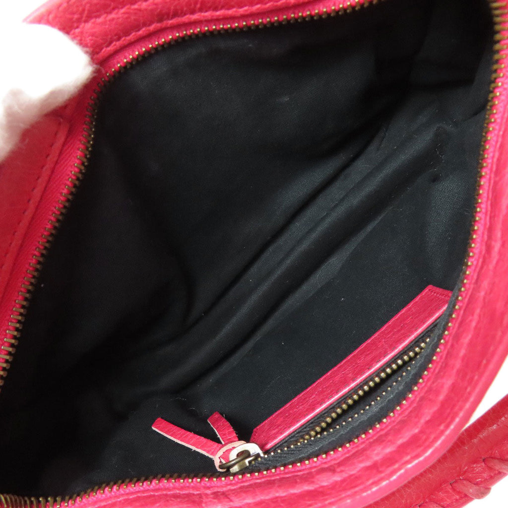 Interior view of a Balenciaga bag in red, showcasing second hand condition and spacious design