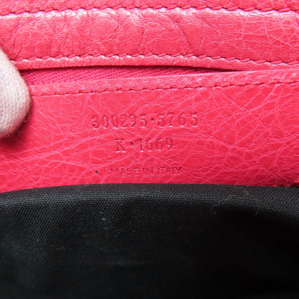 Balenciaga pink bag interior featuring second hand identification tag and high-quality leather craftsmanship
