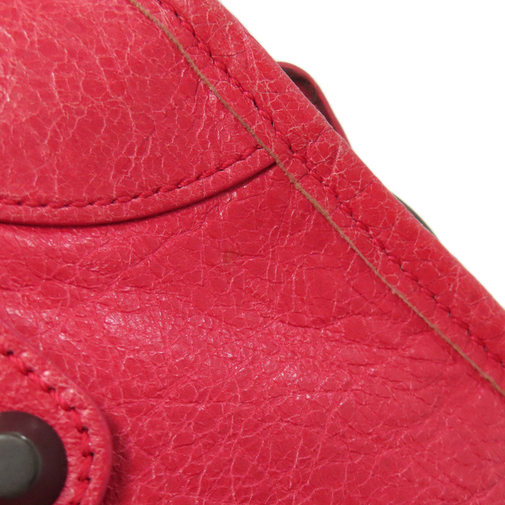 Second hand Balenciaga red leather bag with detailed stitching and button closure