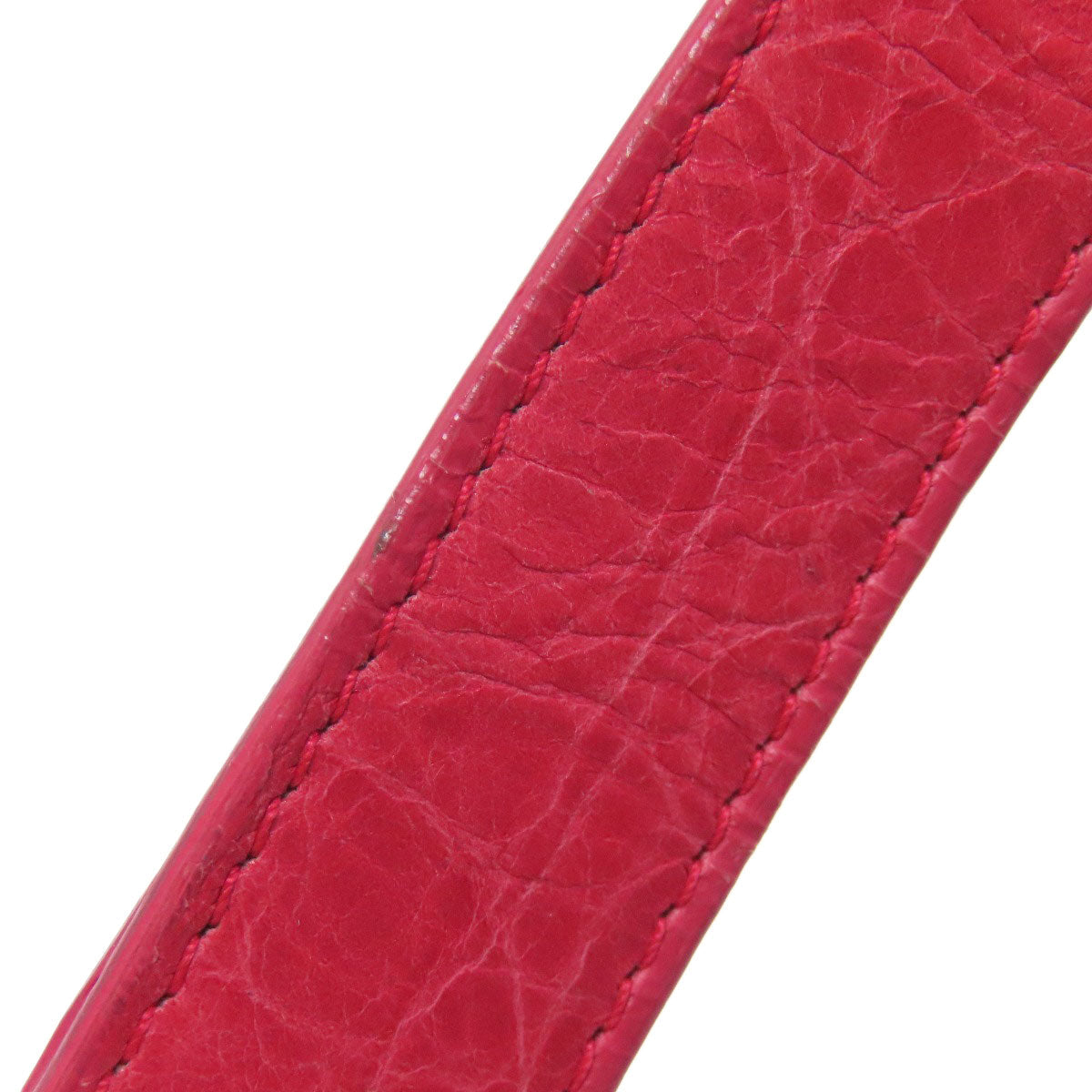 BALENCIAGA Second hand bag strap in vibrant pink leather with a textured finish