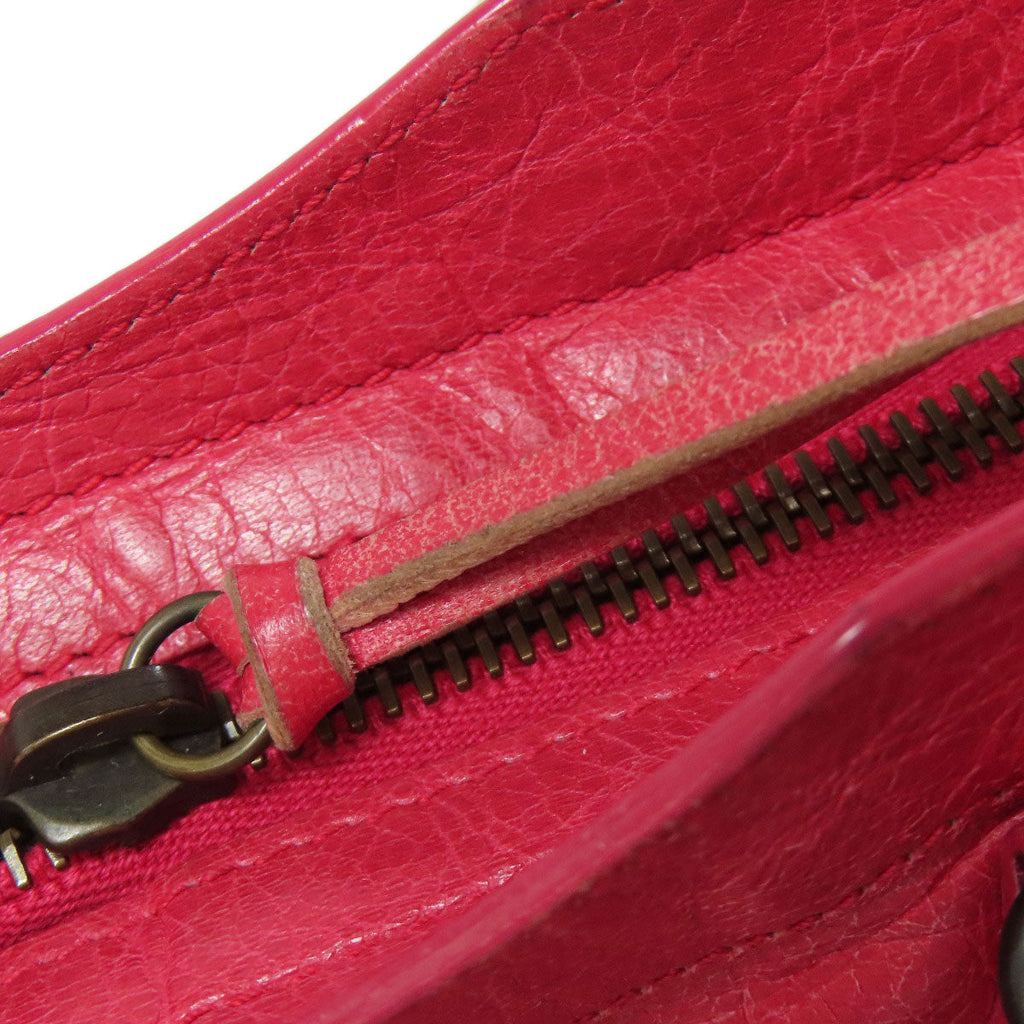 Second hand Balenciaga pink leather bag interior showing zipper details and soft texture