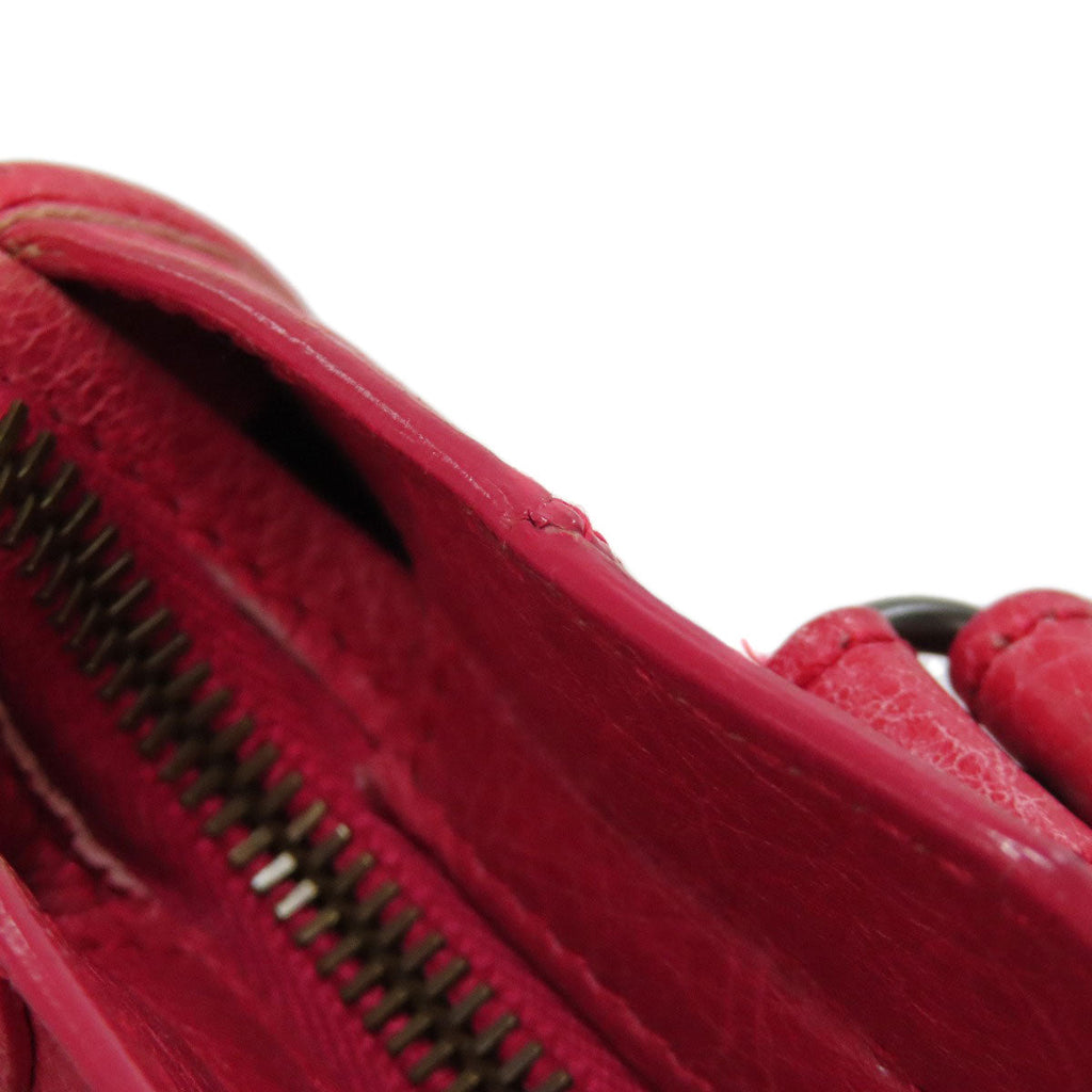 Second hand Balenciaga red leather bag featuring a spacious interior and zipper detail