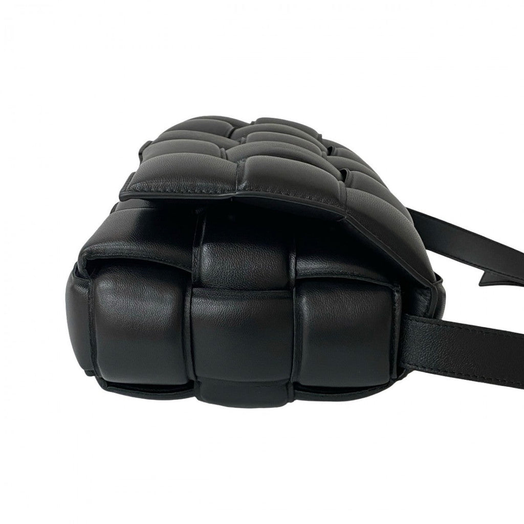Bottega Veneta second hand black leather bag with distinctive padded design and adjustable strap