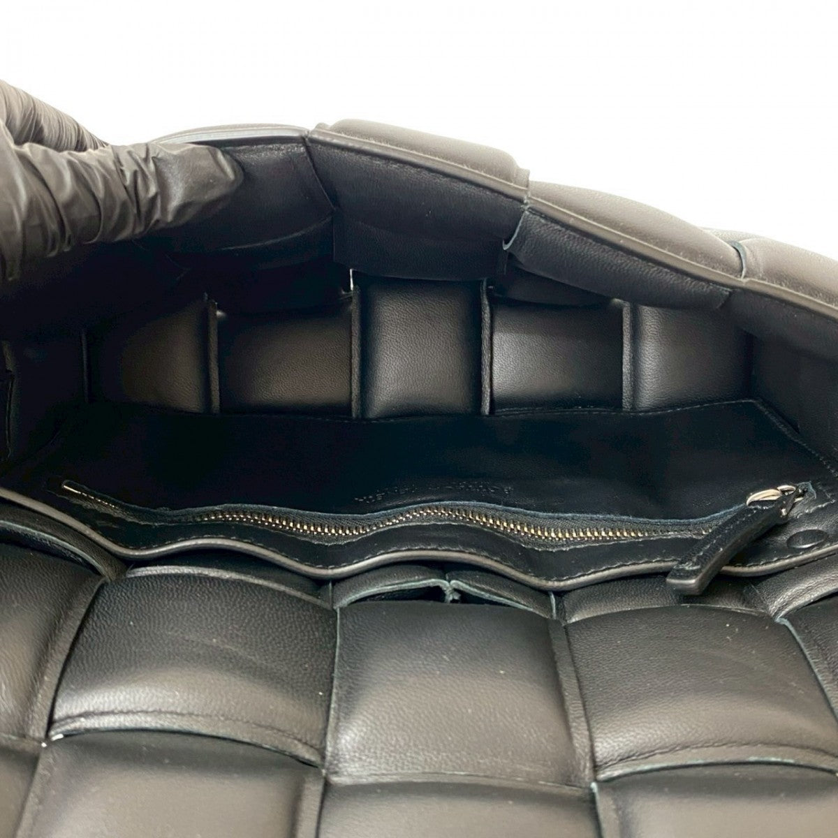Inside view of a BOTTEGAVENETA bag showcasing the soft lining, ideal for second hand luxury shoppers
