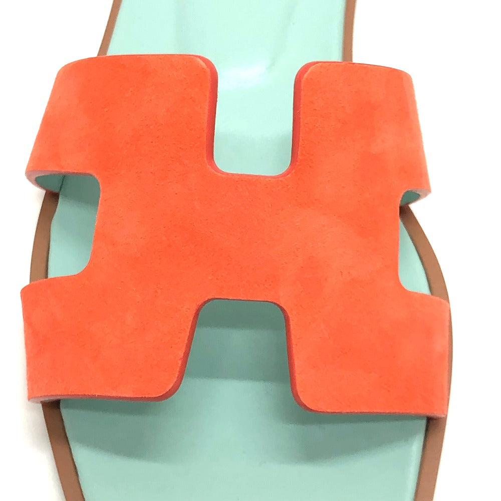 HERMES second hand sandals featuring an orange H logo on a mint green sole