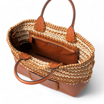 Valentino Garavani pre-owned bag with woven design and leather accents for stylish everyday use