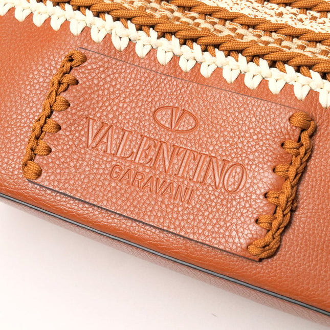 Valentino Garavani pre-owned bag with unique woven detailing and logo embossed design