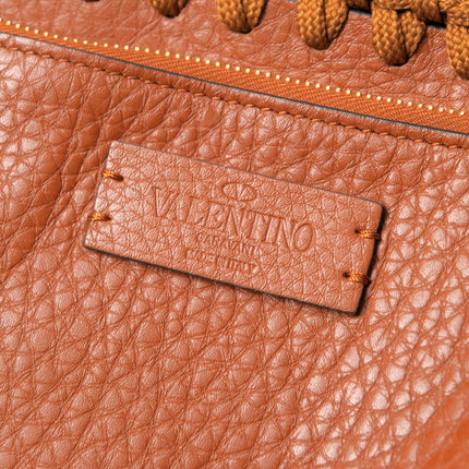Valentino Garavani pre-owned leather bag with signature tag and textured finish