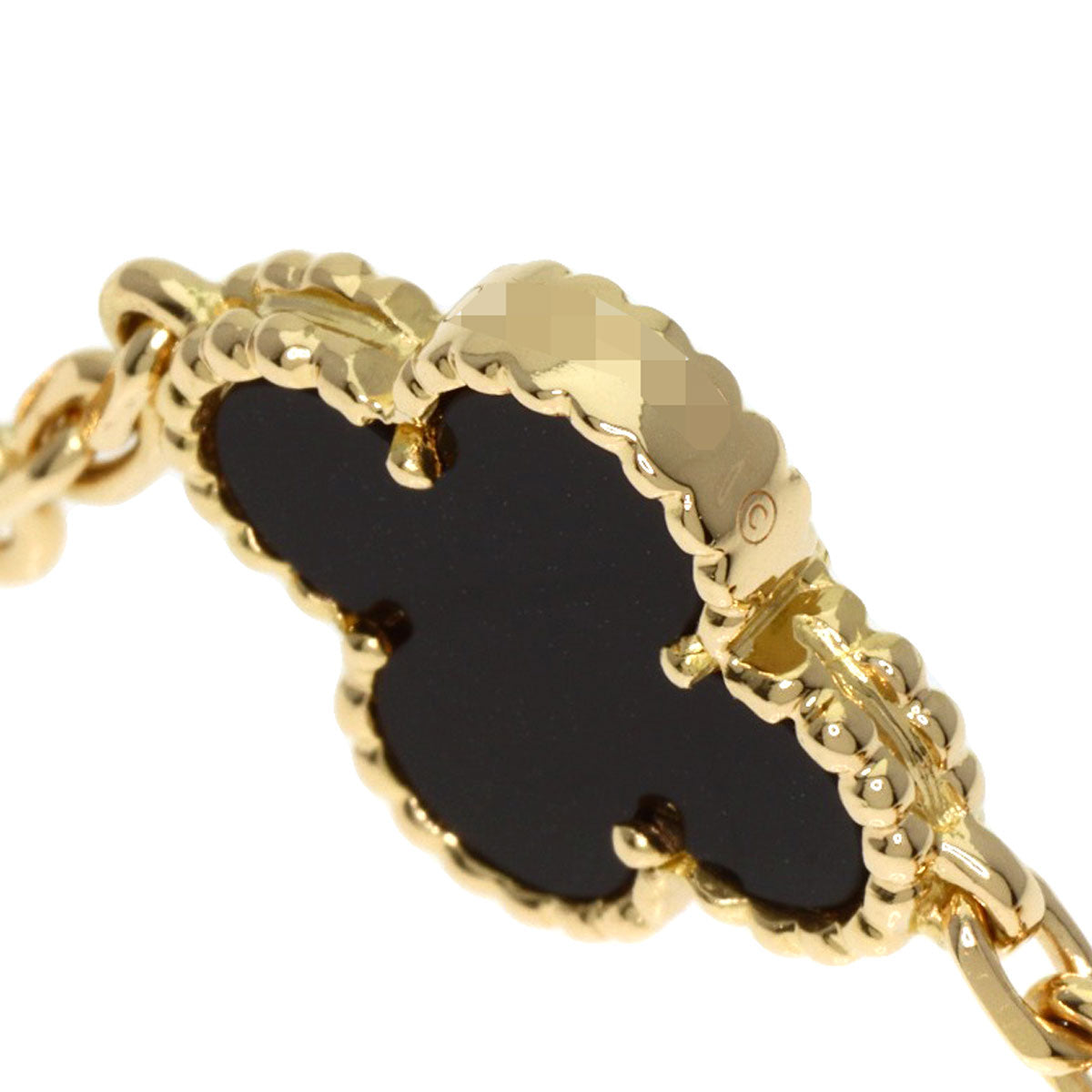 Elegant used Van Cleef 18K gold bracelet featuring a black ornament design for luxury accessory lovers