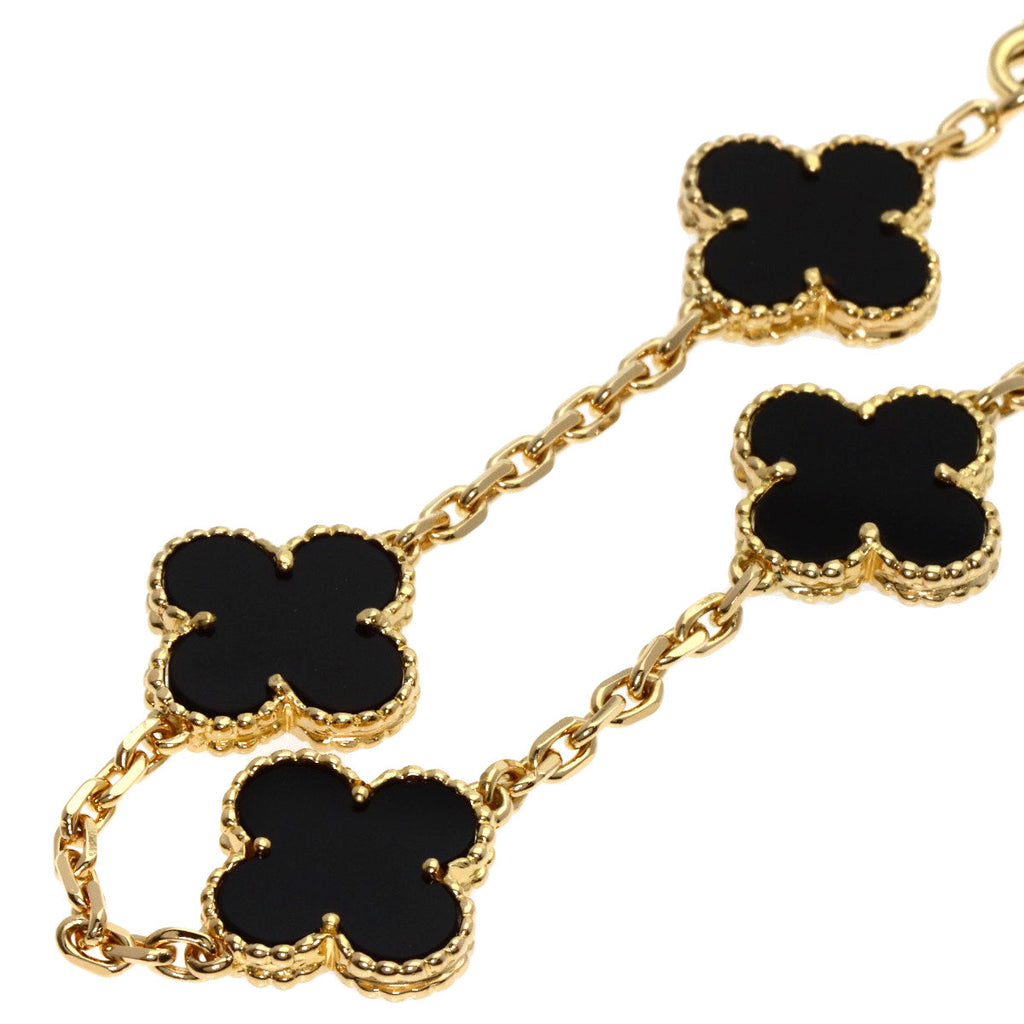 Elegant used Van Cleef 18K gold bracelet with black enamel clover motifs for a luxurious touch
