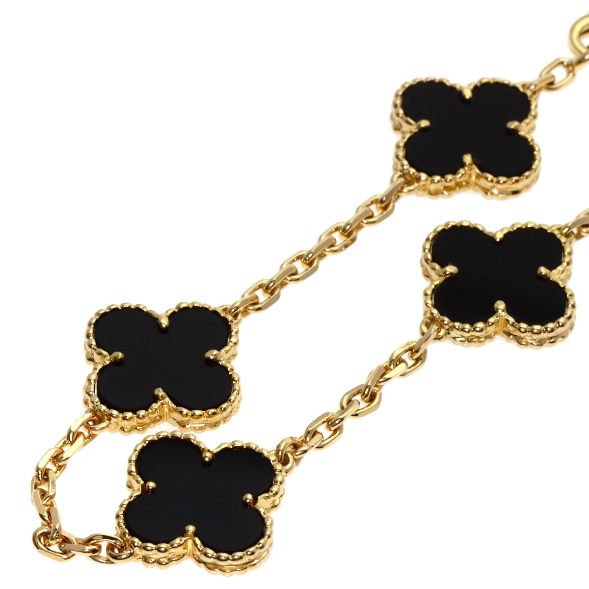 Elegant used Van Cleef 18K gold bracelet with black enamel clover motifs for a luxurious touch