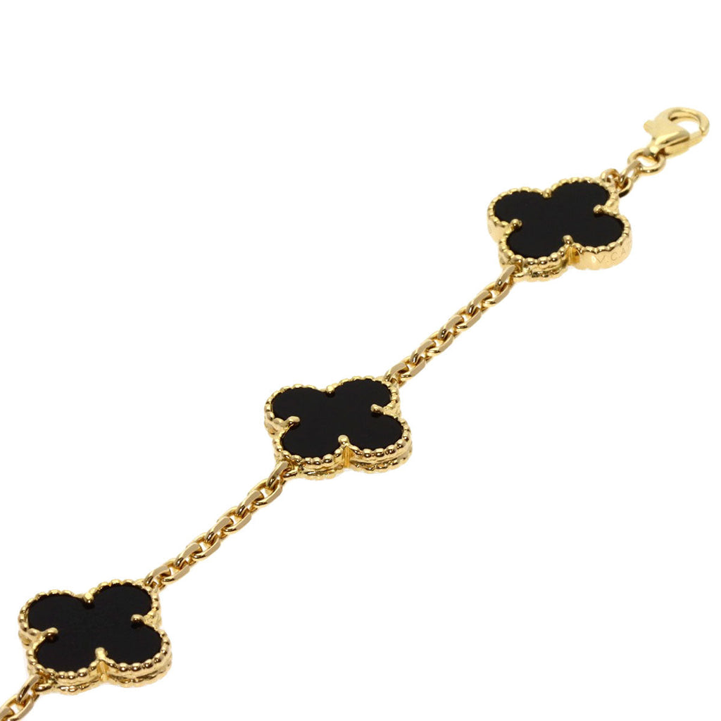 Used Van Cleef 18K gold bracelet featuring a design with onyx clover motifs for elegant jewelry lovers