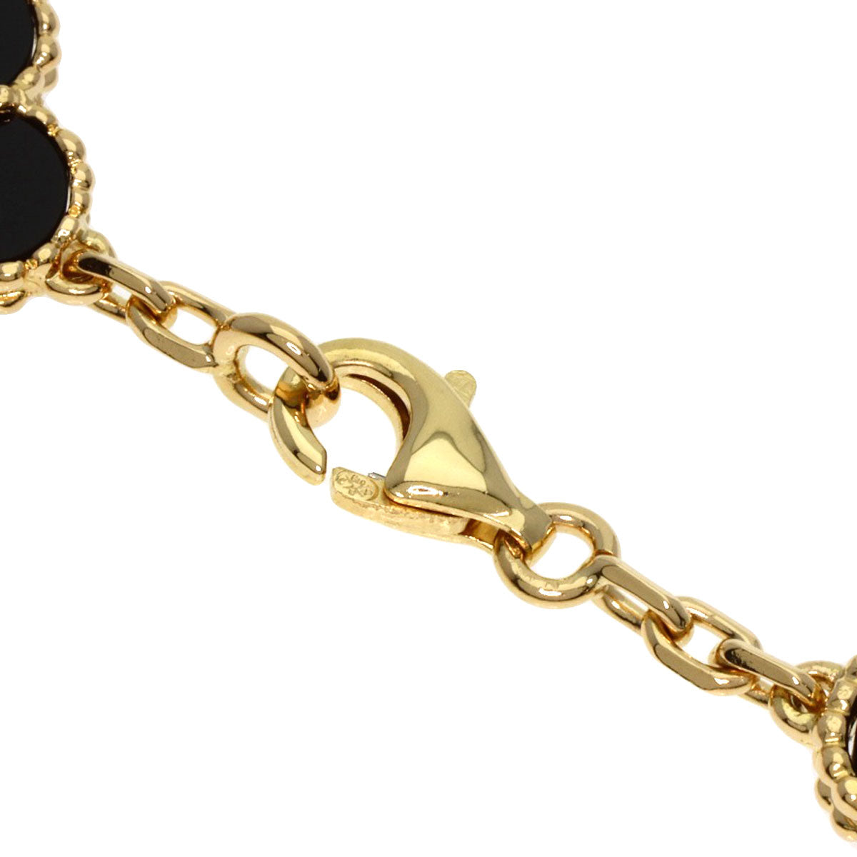 Close-up of a used Van Cleef 18K gold bracelet featuring a clasp and elegant design