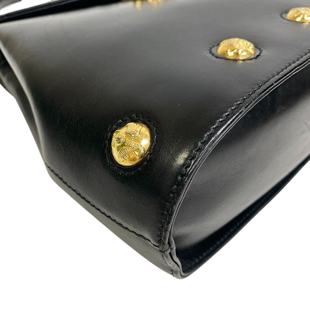 Salvatore Ferragamo vintage black bag featuring gold studs for a classic look