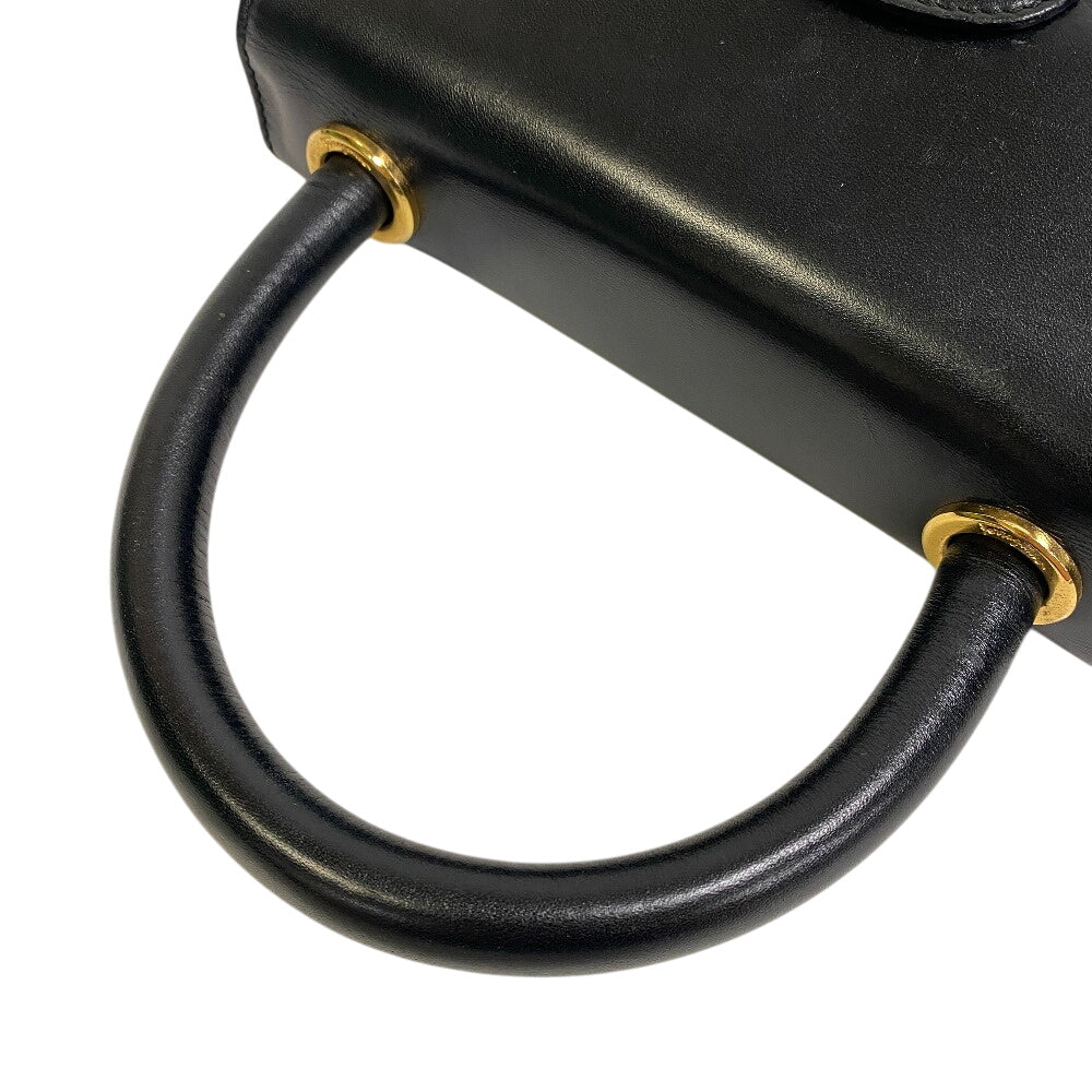 Salvatore Ferragamo vintage black handbag with gold accents and stylish round handle