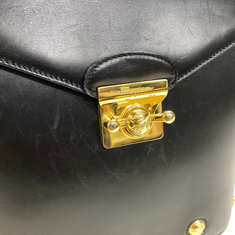 Salvatore Ferragamo vintage black leather bag with a stylish gold clasp and elegant design