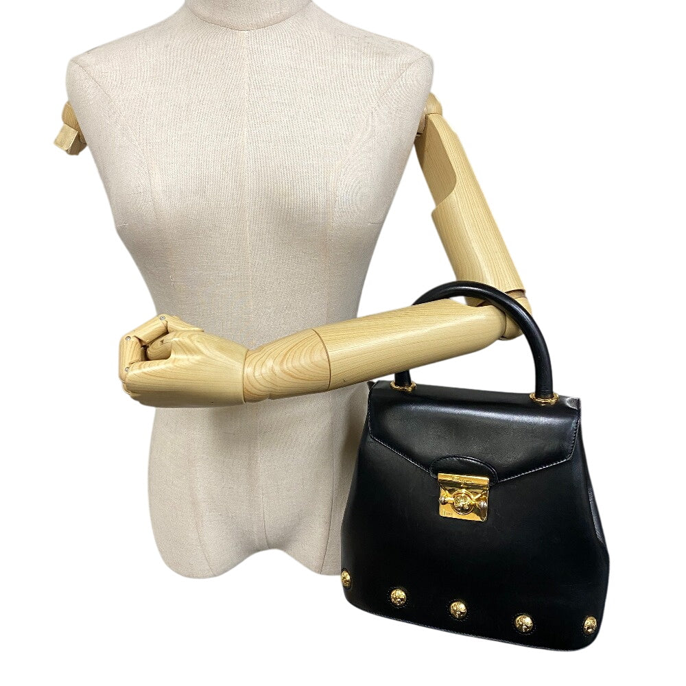 Salvatore Ferragamo vintage black handbag with gold accents and structured design