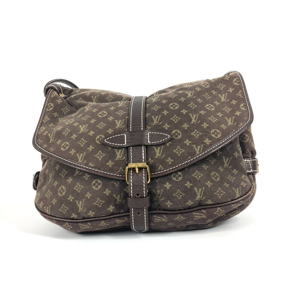 Vintage Louis Vuitton shoulder bag featuring iconic monogram pattern and adjustable strap